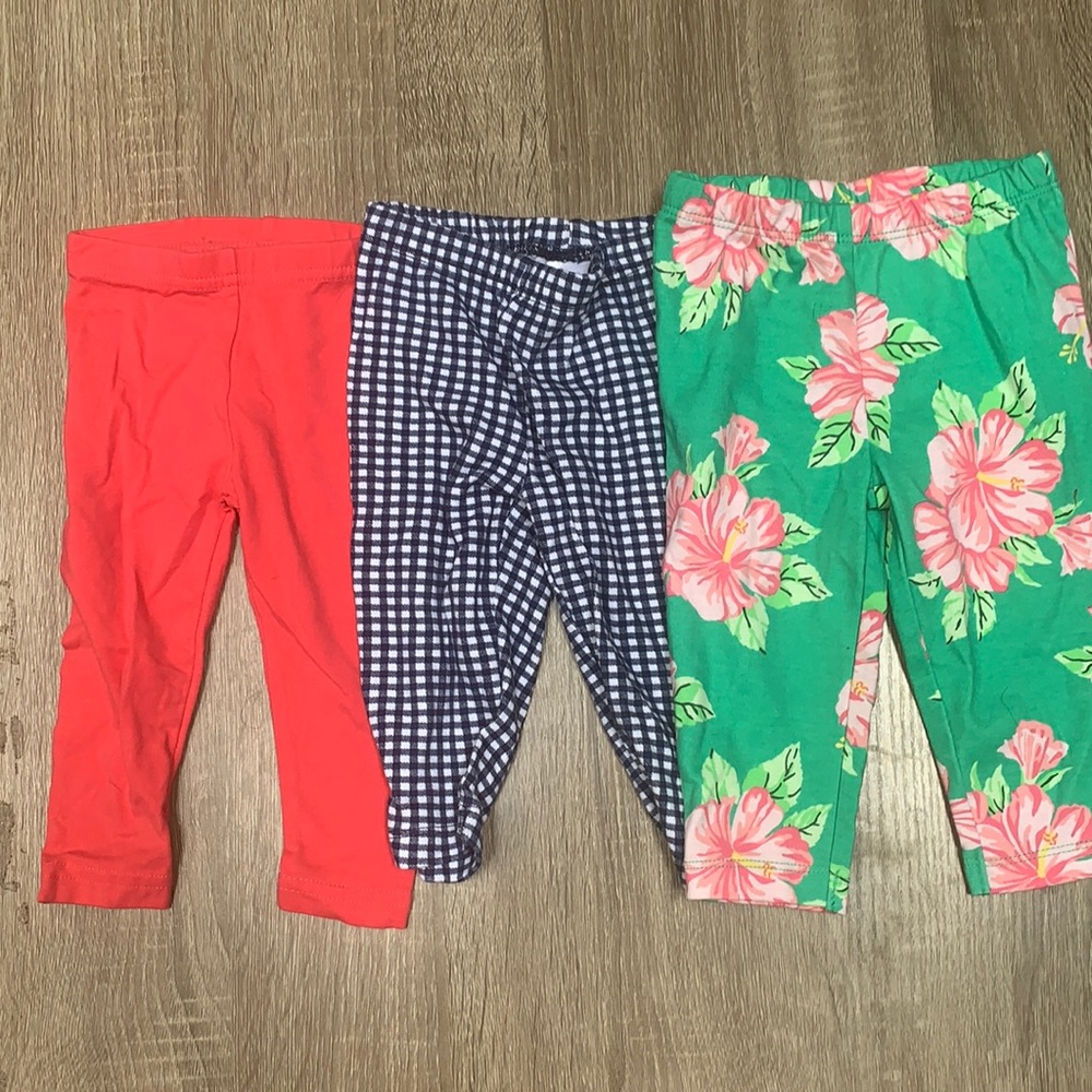 Three pairs of Carter’s 6 month girls pants